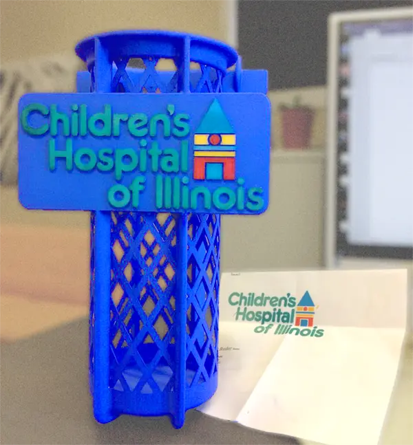 The finished SLS 3D printed bracket, fully assembled and featuring a hand-colored logo. | NW Rapid Manufacturing SLS 3D printing solutions